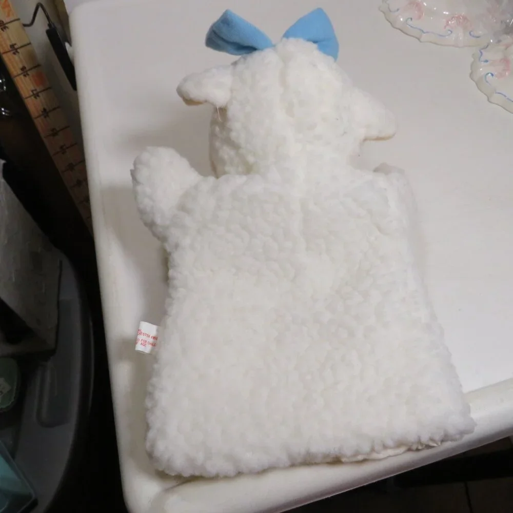 vintage sheep puppet with blue bow sewn on, lined inside thick heavy fur fabric